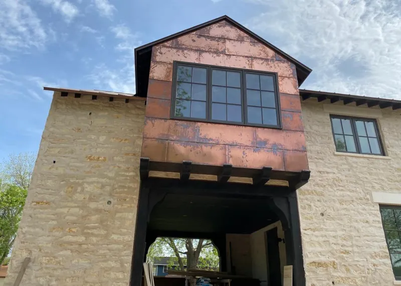 Copper metal panel facade on a stone building for Skylight Installation in Allamuchy